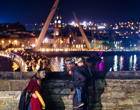 Family Standing on the Bridge at Derry Halloween